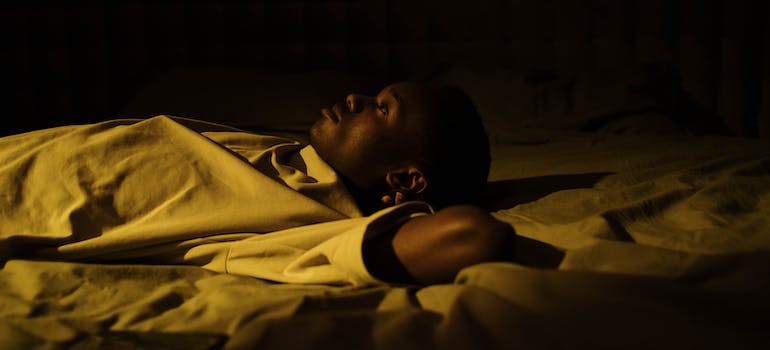 A young person struggling with insomnia, which is a result of ritalin addiction in West Virginia's youth