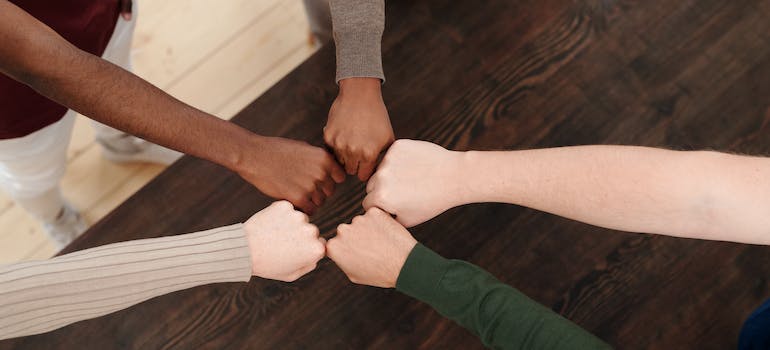 People putting hands together