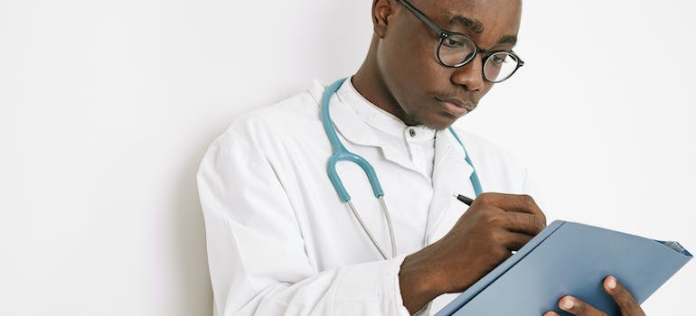 A therapist writing on paper