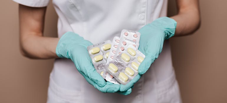 A doctor holding pills representing Ritalin addiction in West Virginia's youth.