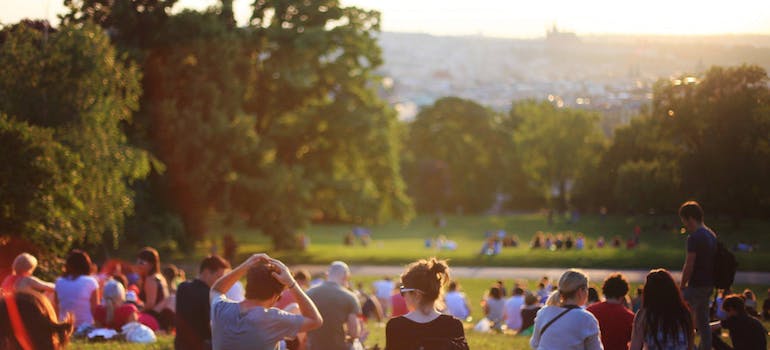 Many people sitting in a park representing Cultural Factors in Addiction in West Virginia
