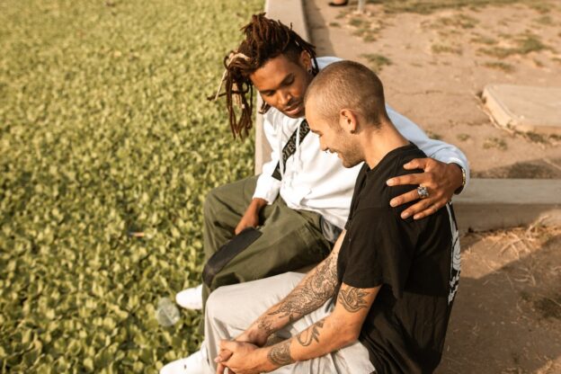 Two men sitting in a park