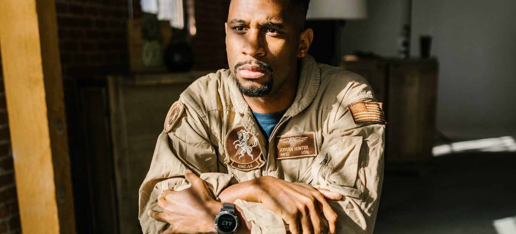 A veteran sitting alone, looking thoughtful
