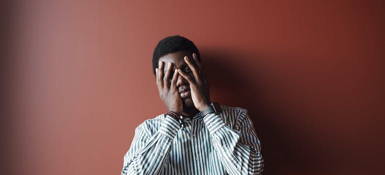 A person covering their face