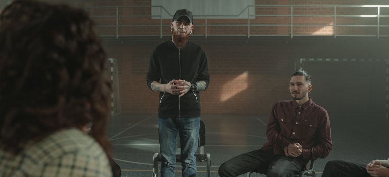 A man talking in group therapy
