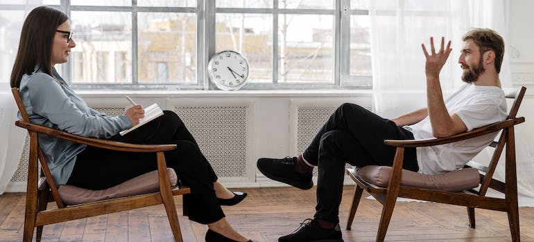 man talking to a therapist after adventure-based therapy in West Virginia.
