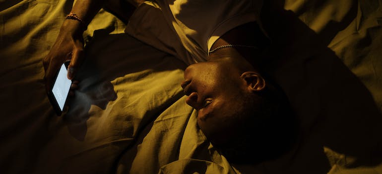 A person having trouble sleeping after mixing Adderall and alcohol