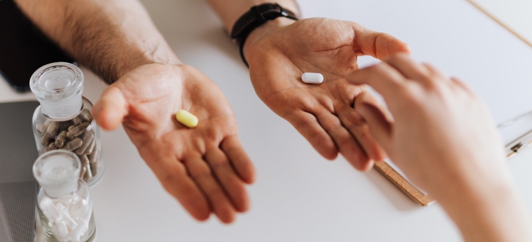 A pill on each palm for mixing Lexapro and Trazodone