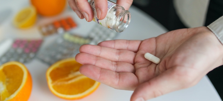 A white pill on a palm
