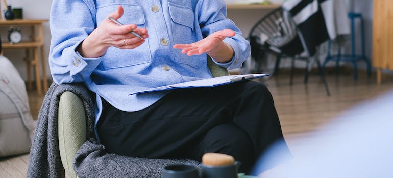 A therapist talking during a session