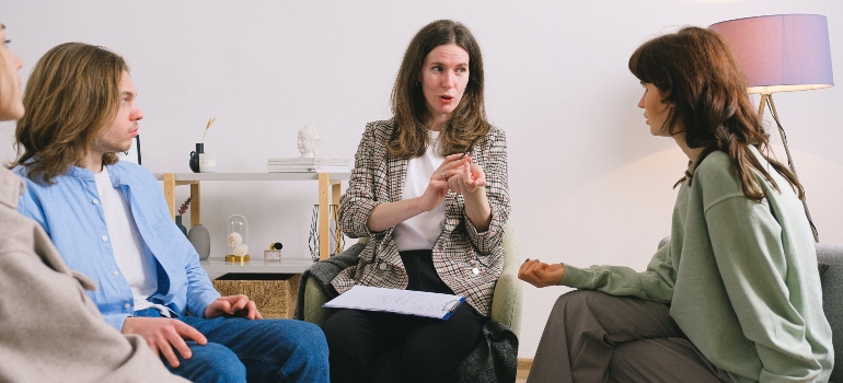 A man and a woman talking to a therapist