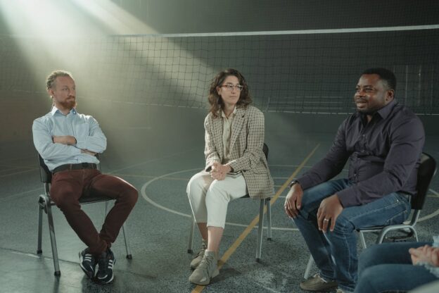 Three people in a meeting during 12-step programs in wv