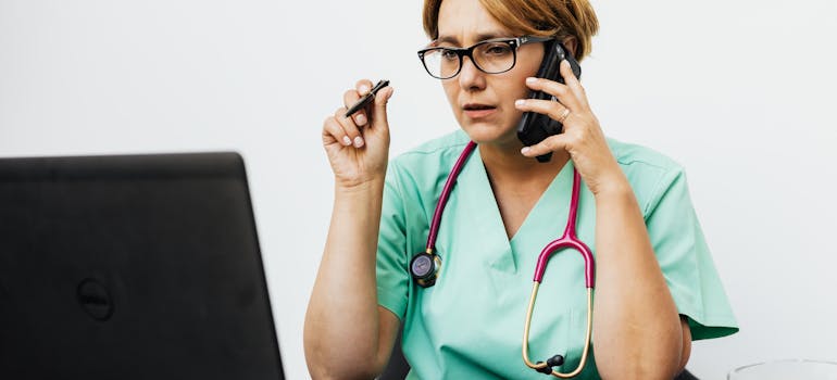 doctor talking to a patient on the phone.