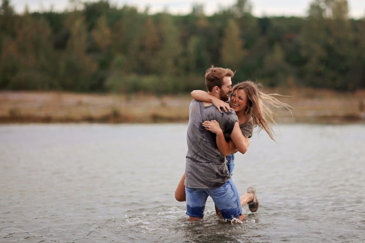 A couple hugging in a lake