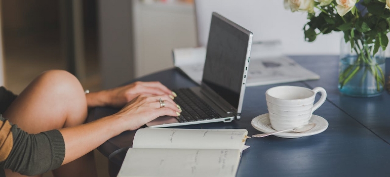 A person using a laptop in the first year of sobriety.