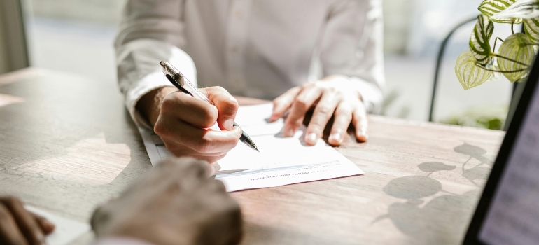 A person signing a consent for using Psychedelics in Addiction Treatment in WV