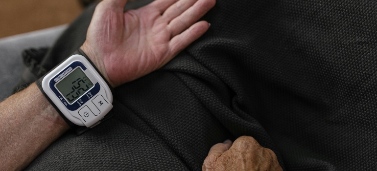 A man measuring his blood pressure using a smart watch