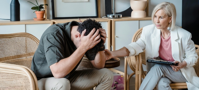 A worried man talking to a doctor