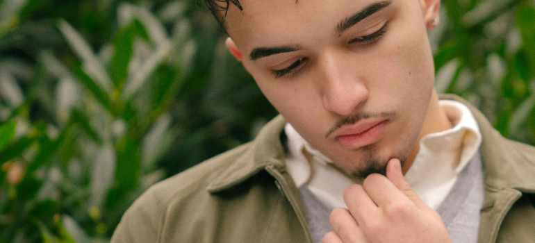 a man thinking about what are the stages of addiction