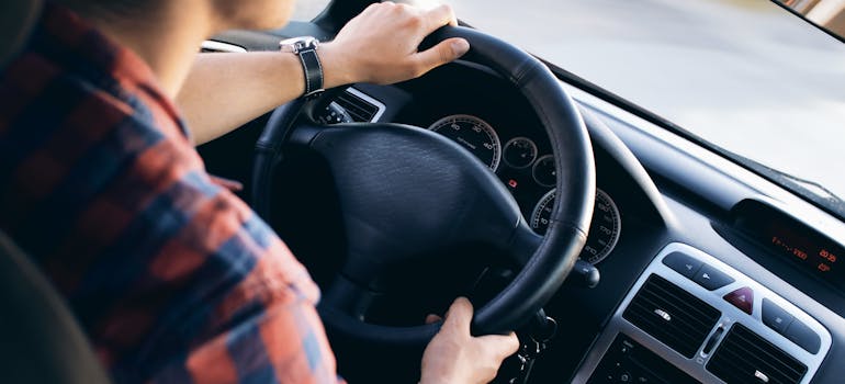 man driving a car.