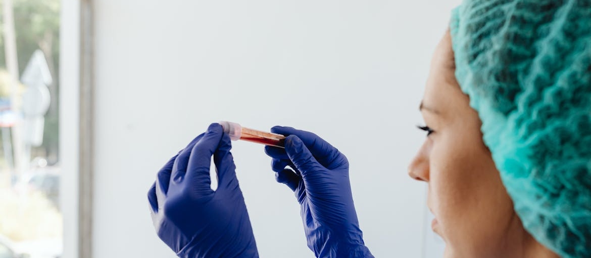 A person holding a test tube.