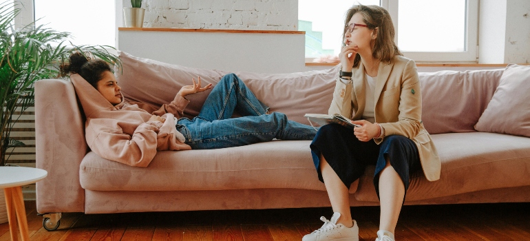 A girl laying on the couch and talking to a therapist about what is Suboxone