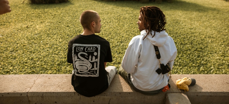 Two men talking about how to support your sibling dealing with addiction