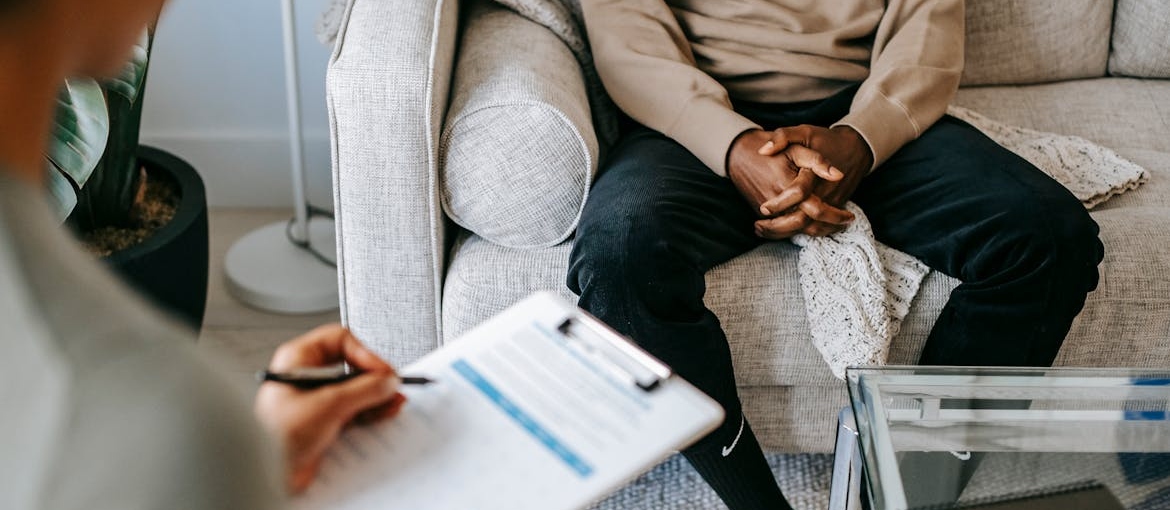 A man talking to a therapist about drugs associated with violent acts.