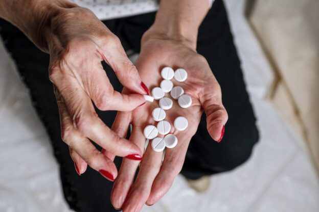 Woman taking her benzodiazepine prescription.