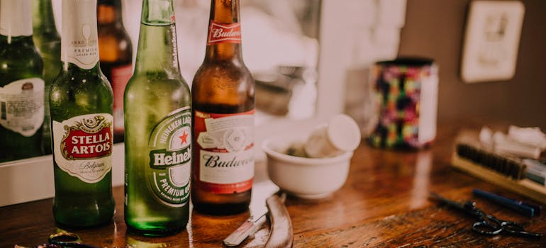 Beer bottles on a wooden table.