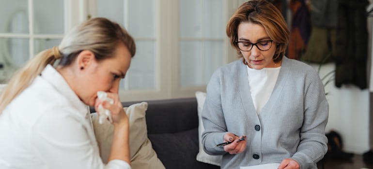 Mother having a tough conversation with her daughter about the dangers of benzodiazepine overuse.