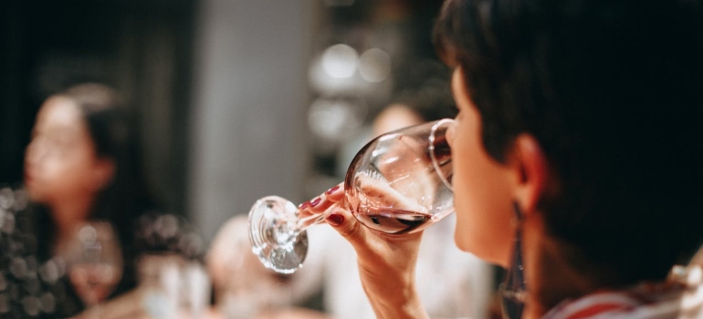 A person drinking wine