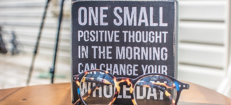 A sign and eyeglasses