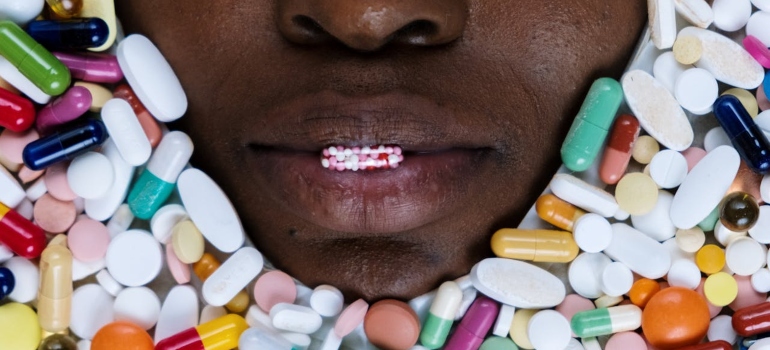 A woman "drowning" in pills