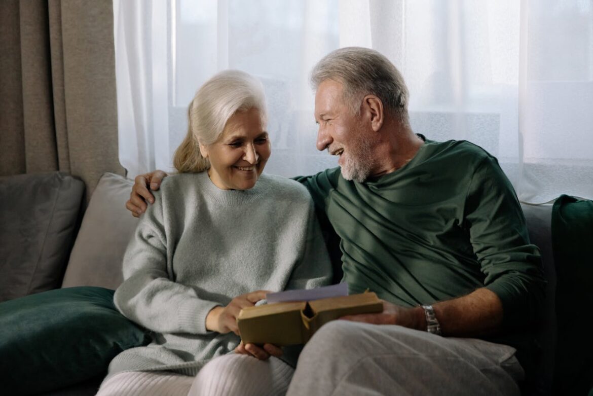A couple reading a book.