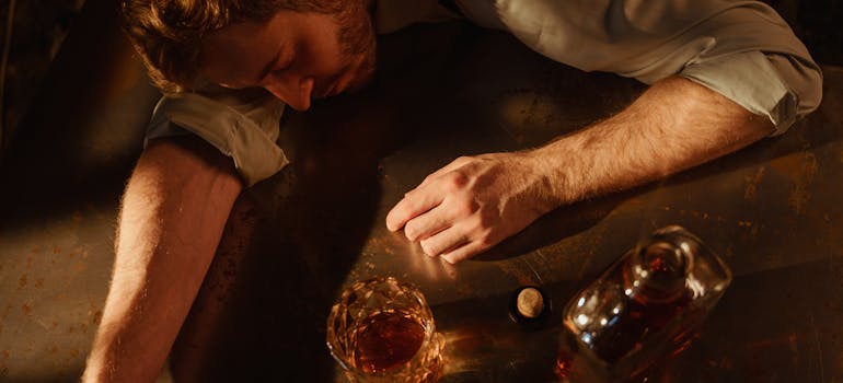 Man passed out after drinking whiskey.
