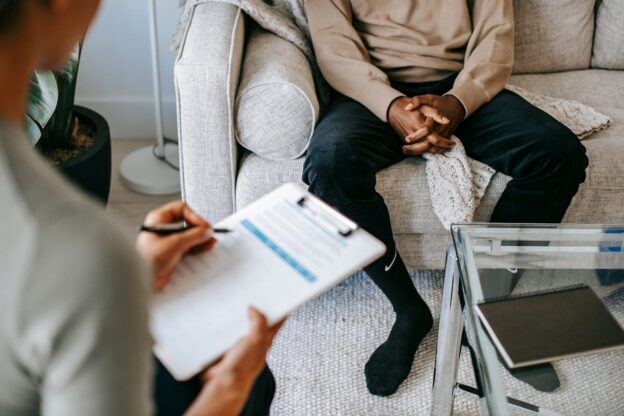 Man talking to his counselor, one of the things you should do when you are not satisfied with treatment in a rehab center.