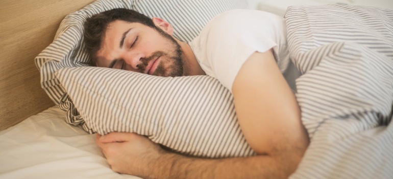 a man sleeping in a bed