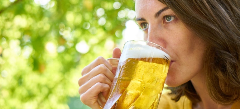 a woman drinking beer