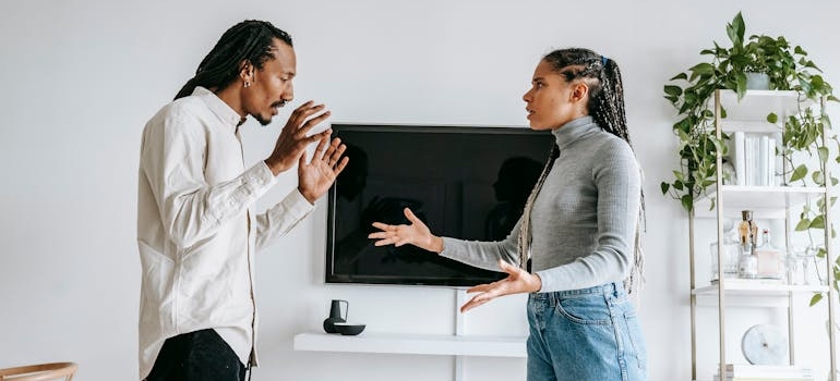 Couple having a fight in their living room.