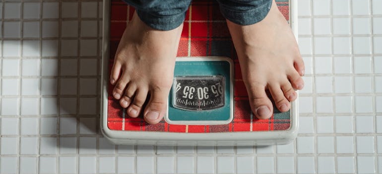 Man standing on a scale.