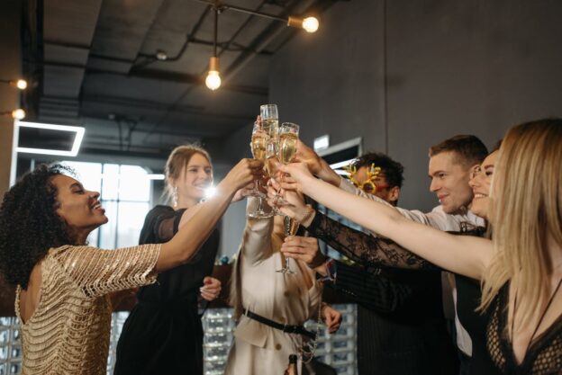 A group of friends celebrating and drinking