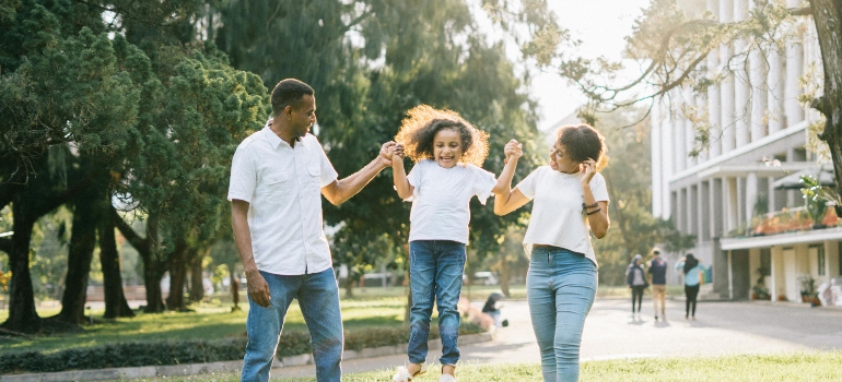 The family is playing at the park.