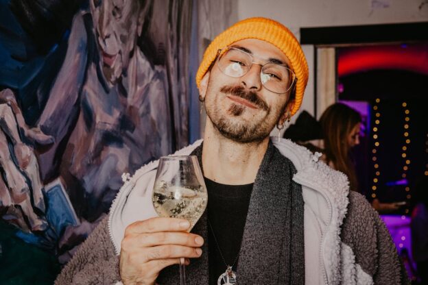 a man holding a glass of alcohol and not thinking about Binge Drinking and Depression