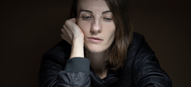 a woman struggling with the side Effects of PCP