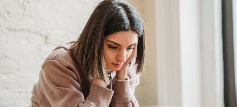 a girl being depressed after drinking