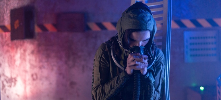 a man inhaling whippits