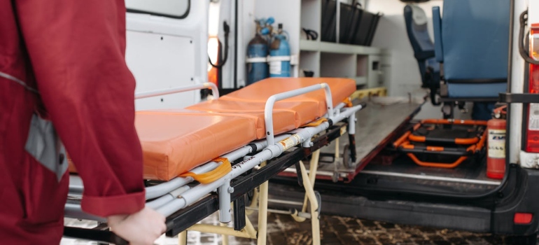 a man from emergency room entering a van