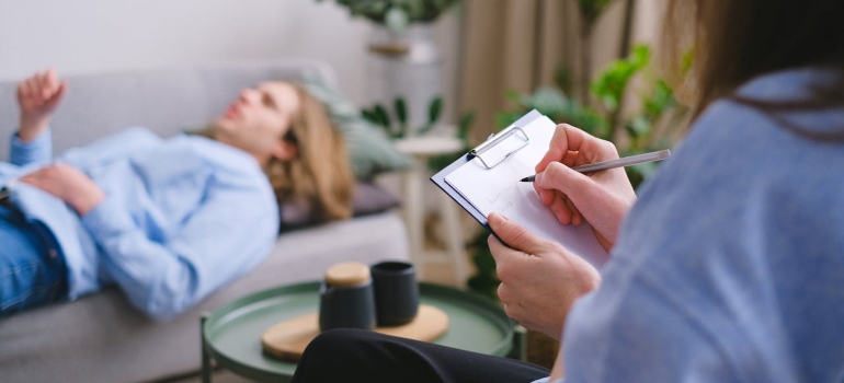 a man in a therapy session lying on the sofa