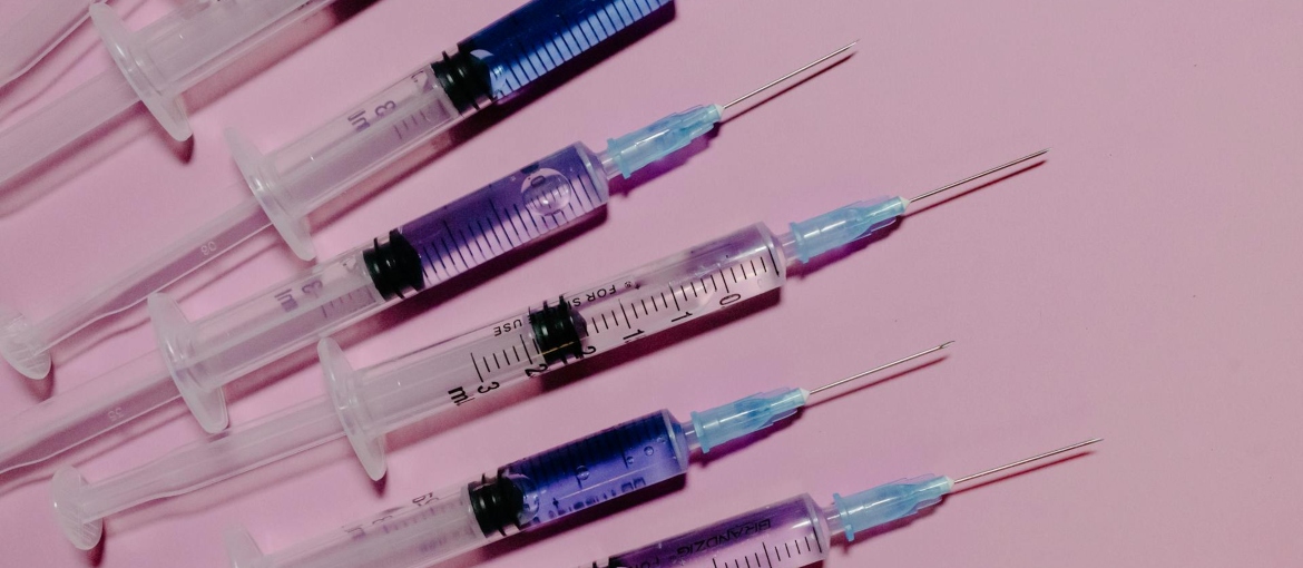 Needles on a pink surface.